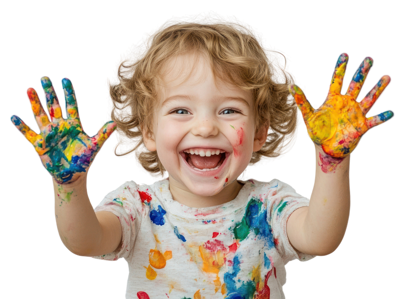 Child artist with finger paint on hands painting and happy